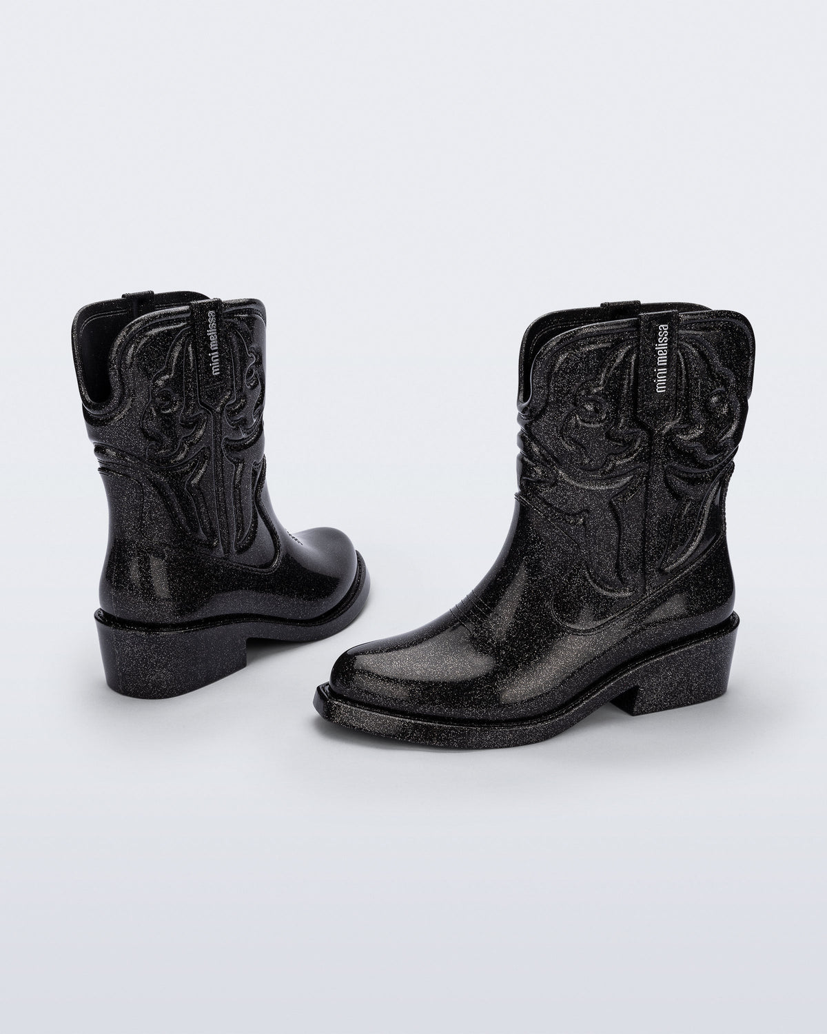 Back and side view of a pair of glitter black Texas kids boots