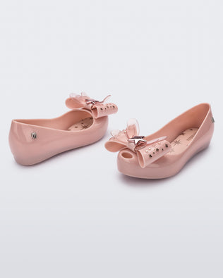 Angled view of a pair of Mini Melissa Ultragirl peeptoe ballet flats in pink with star printed butterfly bow applique. 