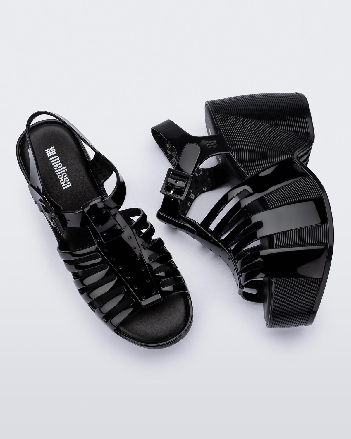 Top and side view of a pair of black Station 79 platform heels with ankle straps