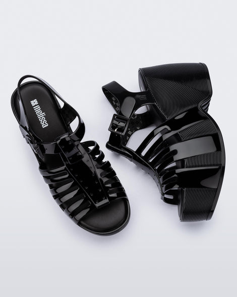 Top and side view of a pair of black Station 79 platform heels with ankle straps