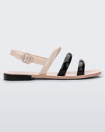Side view of a black and beige Essential Wave women's sandal with adjustable buckle.