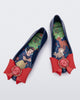 Top view of a pair of blue Sweet Love Snow White kids flats with a red bow with red apple center