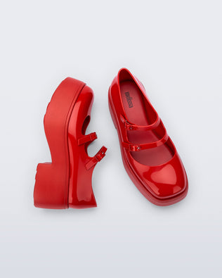 Top and side view of a pair of red Farah platform mary janes