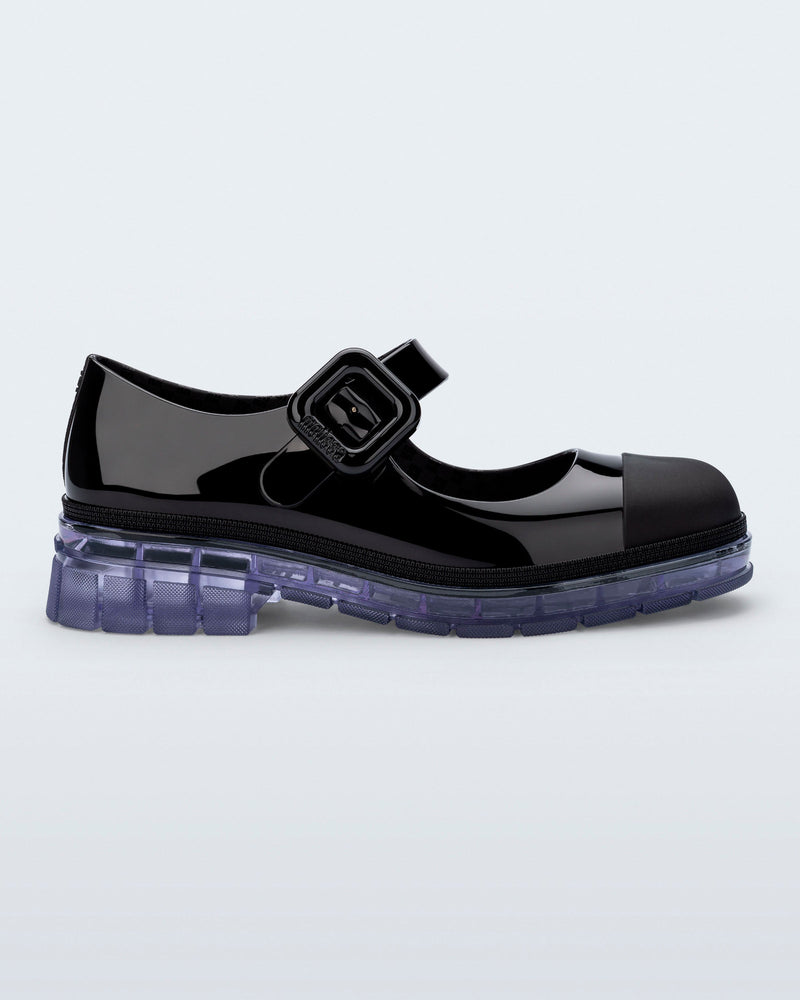 Side view of a black with clear sole June mary jane with matte toe cap