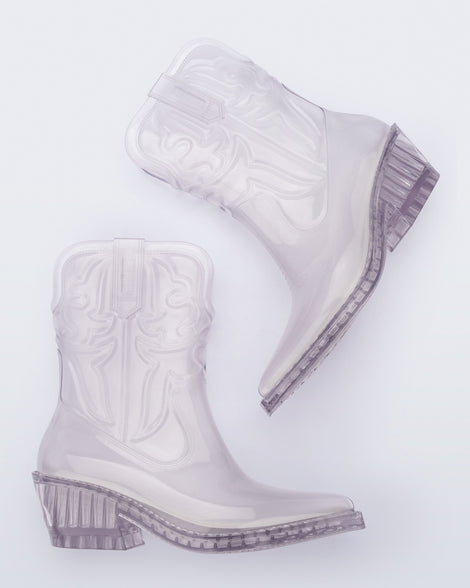 Side view of a pair of clear Texas boots with pointed toe.