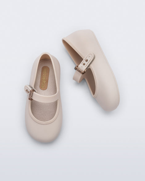 Top and side view of a pair of beige Soft Ballerina baby flat with Velcro strap