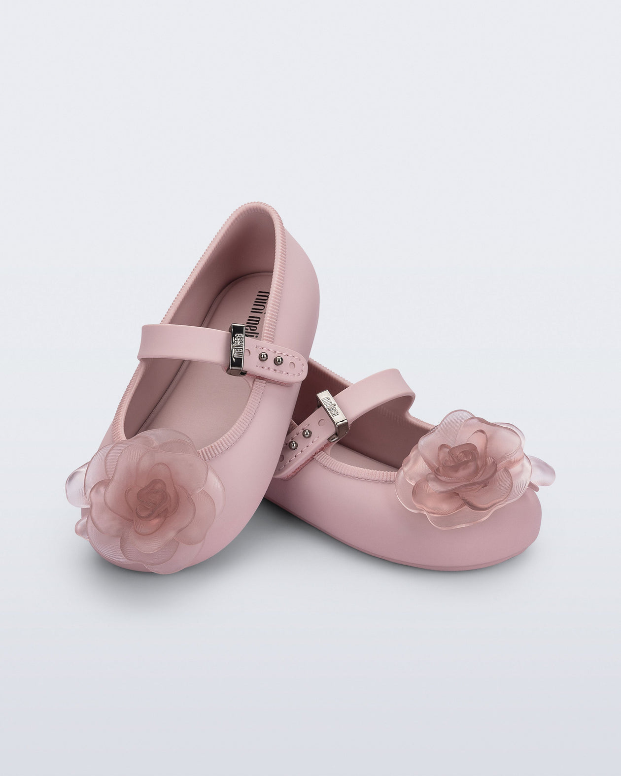 Angled view of a pair of pink Soft Ballerina baby flats with pink flowers