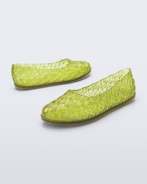 Angled and side view of a pair of clear green Possession Ballerina flats