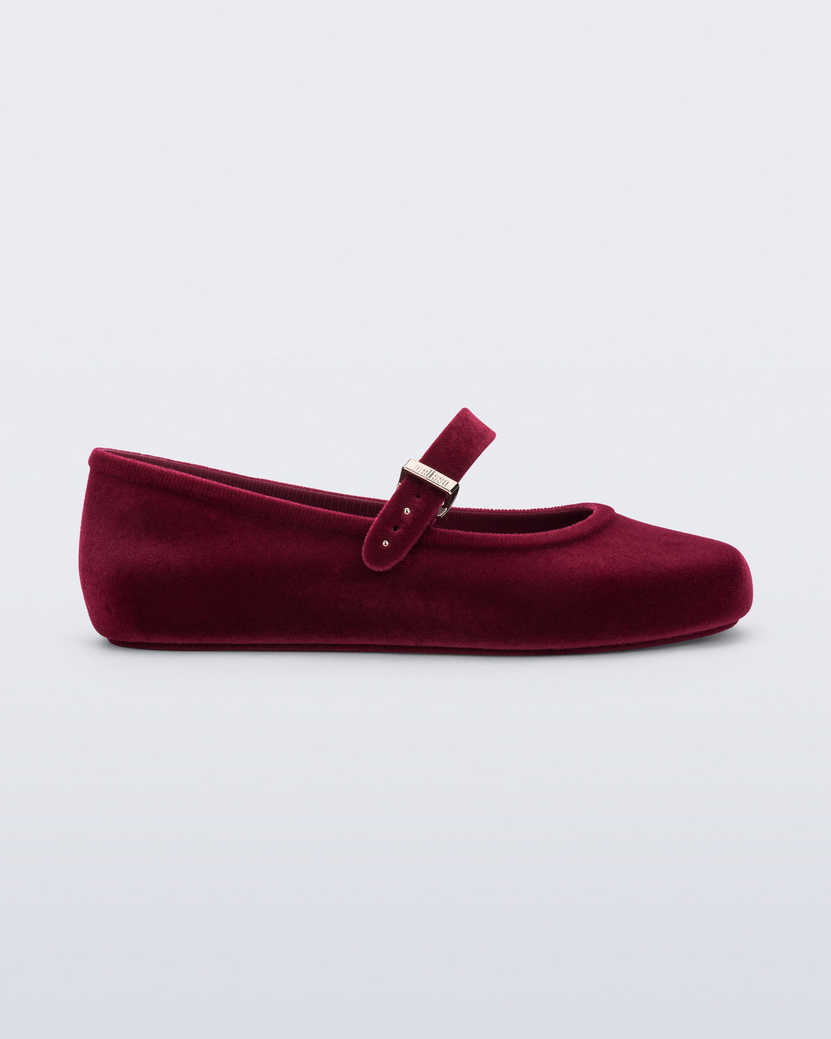 Side view of a red Soft Ballerina Velvet II flat