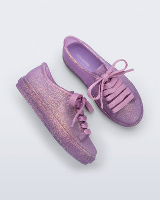 Side and top view of a pair of glitter lilac kids Hip Sneakers lilac laces