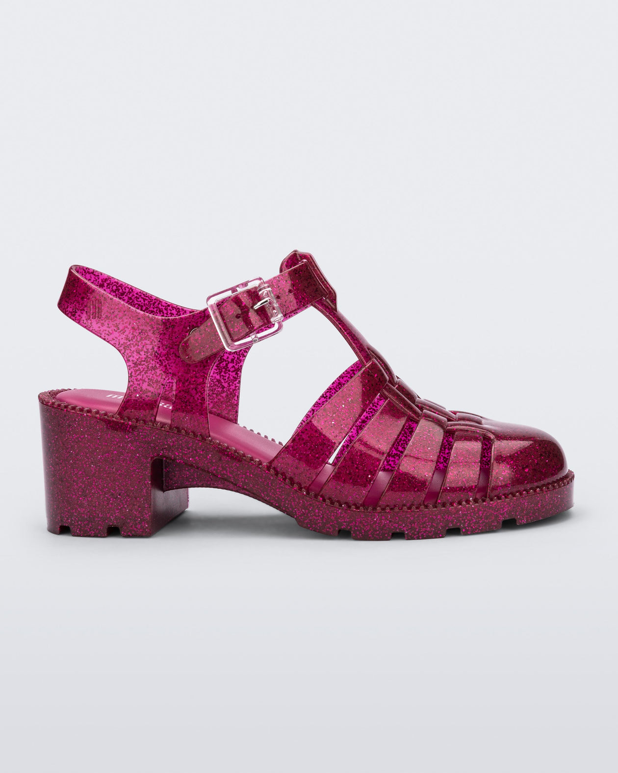 Side view of a glitter pink Possession heel sandal