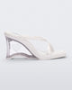 Side view of a white Glass Heel with a heart cutout in the heel.
