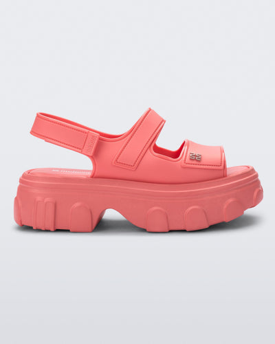 Side view of a pink Ella Move platform sandal.