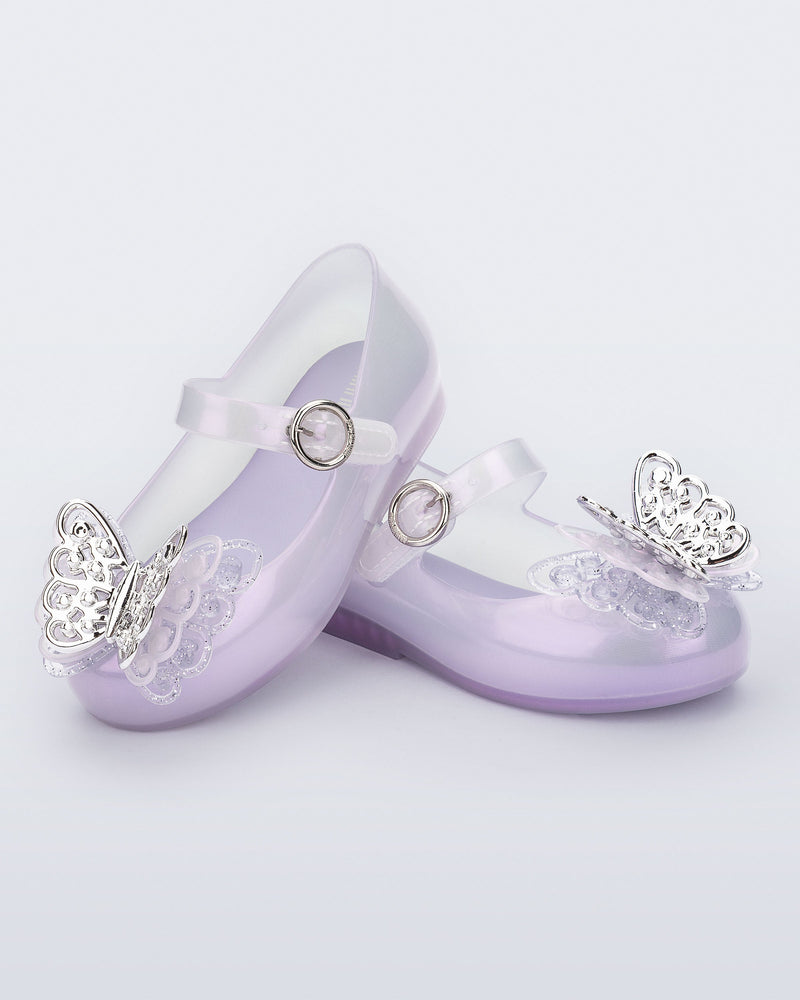 Angled view of a pair of pearly purple Sweet Love Butterfly baby flats