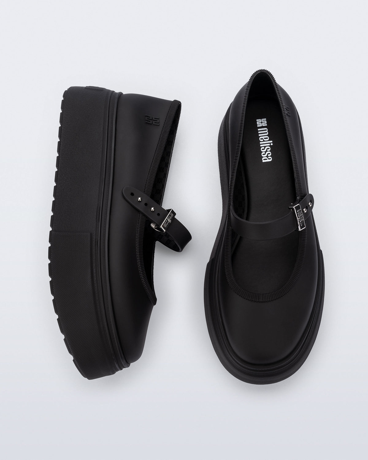 top and side view of a pair of black Soft Ballerina Platform flats