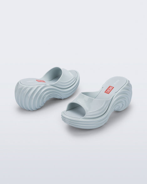 Back and side view of a pair of light blue Platforms + Diesel slides