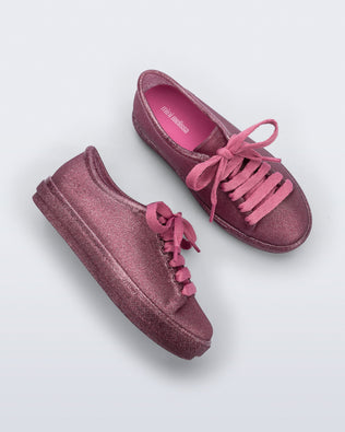 Side and top view of a pair of glitter pink kids Hip Sneakers pink laces