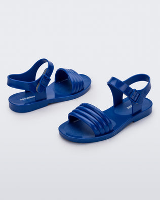 Angled view of a pair of blue Mar Wave kids sandals.