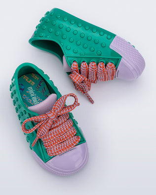 Top and side view of a pair of green and purple Polibolha baby sneakers with multicolor laces.