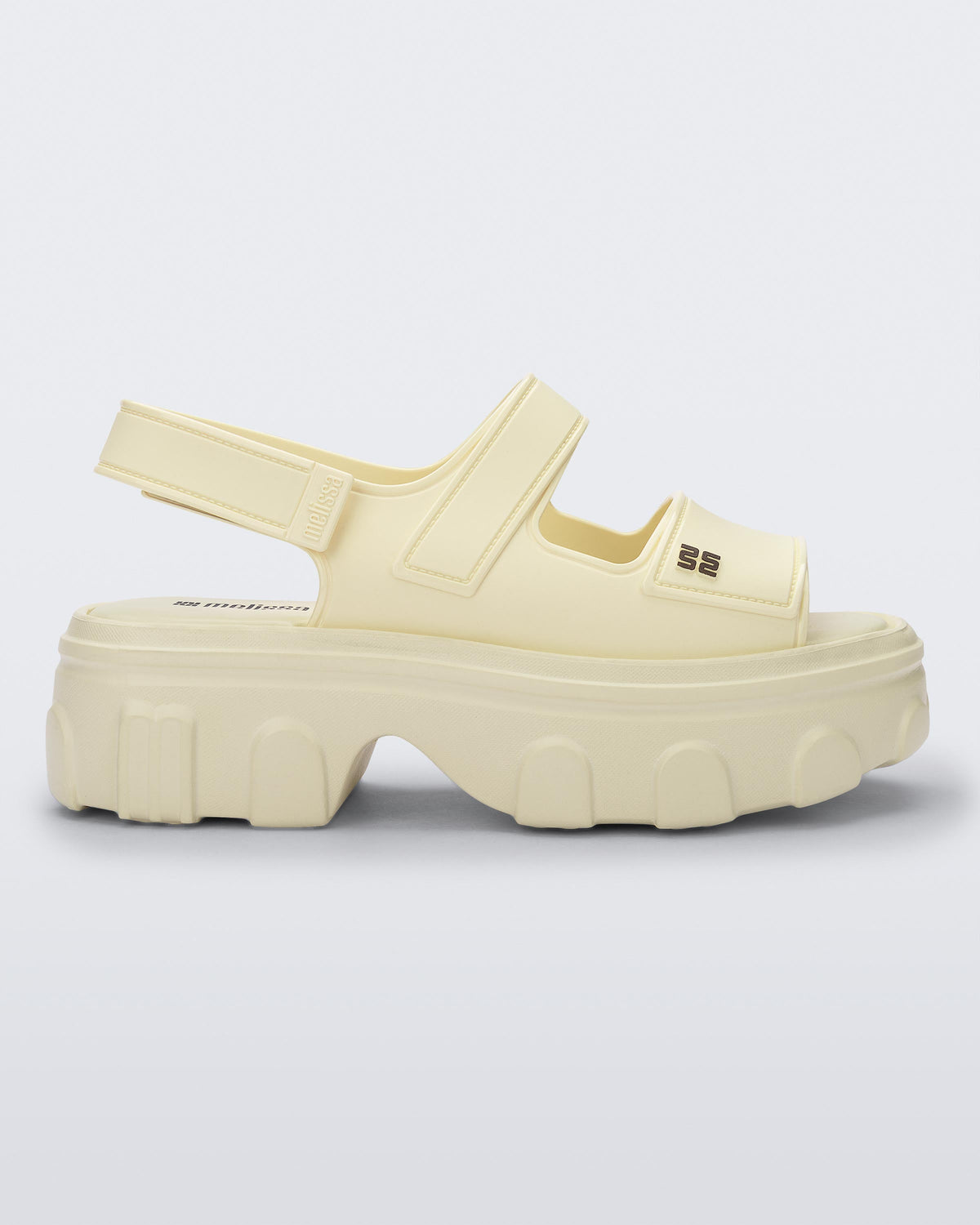 Side view of a beige Ella Move platform sandal