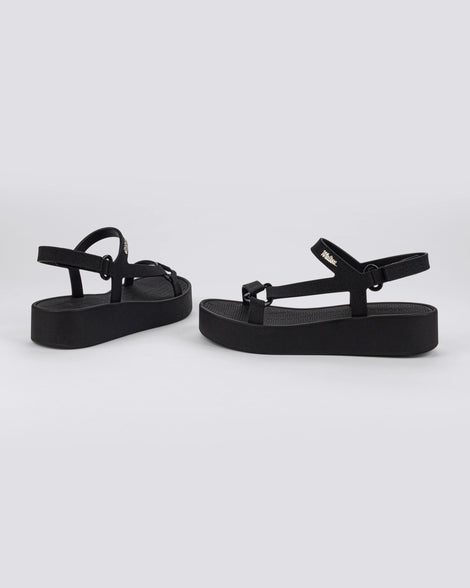 Angled side and back view of a pair of black Sun Downtown Platform sandals