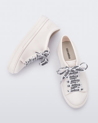 Top and side view of a pair of white Hip M Lover kids sneakers with laces.