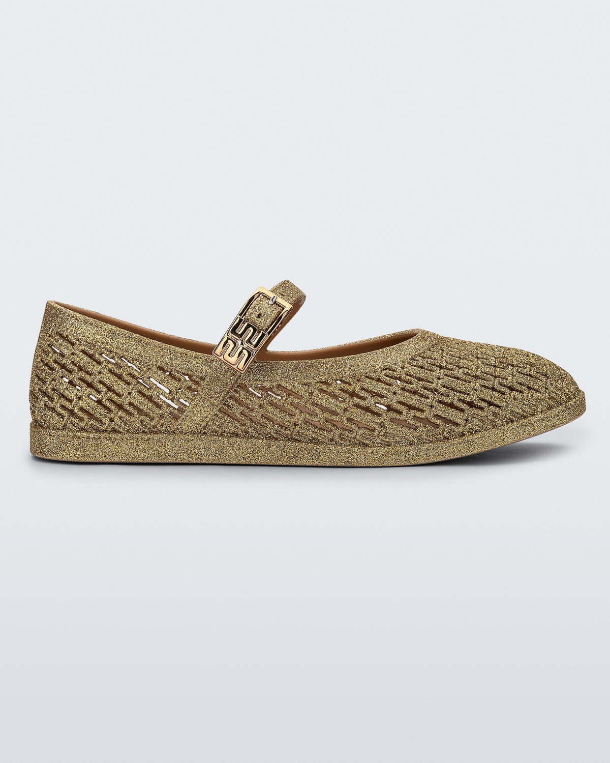 Side view of a beige glitter Harper flat with strap