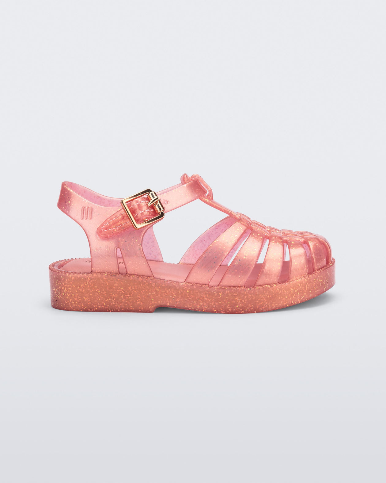Side view of a pearly pink Possession sandal