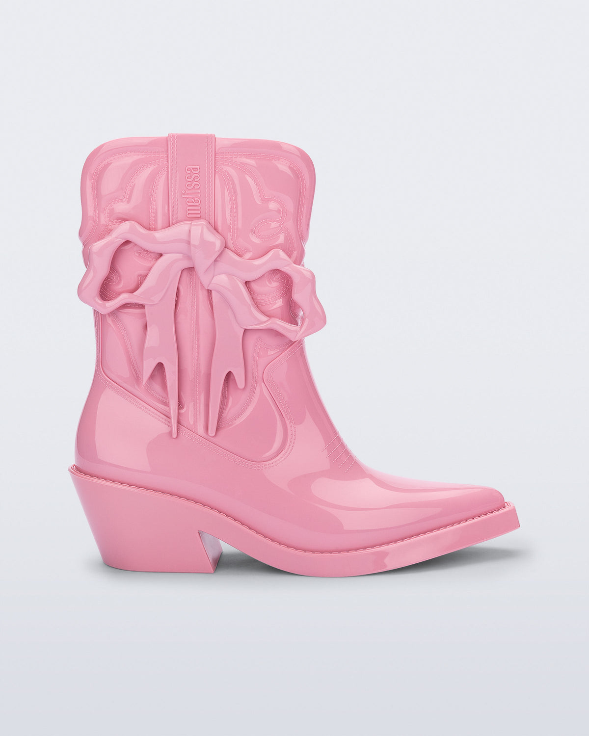 Side view of a pink Texas + Maldito boot