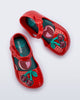 Top view of a pair of red Pop baby flats with two dark red cherries