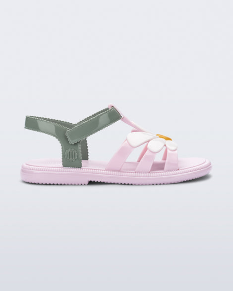 Side view of a kids pink and green Hip Bloomy sandal