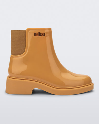 Side view of a caramel Chelsea boot