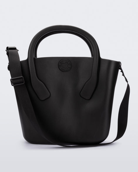 Back view of a black Free Big Bag with handles and a strap