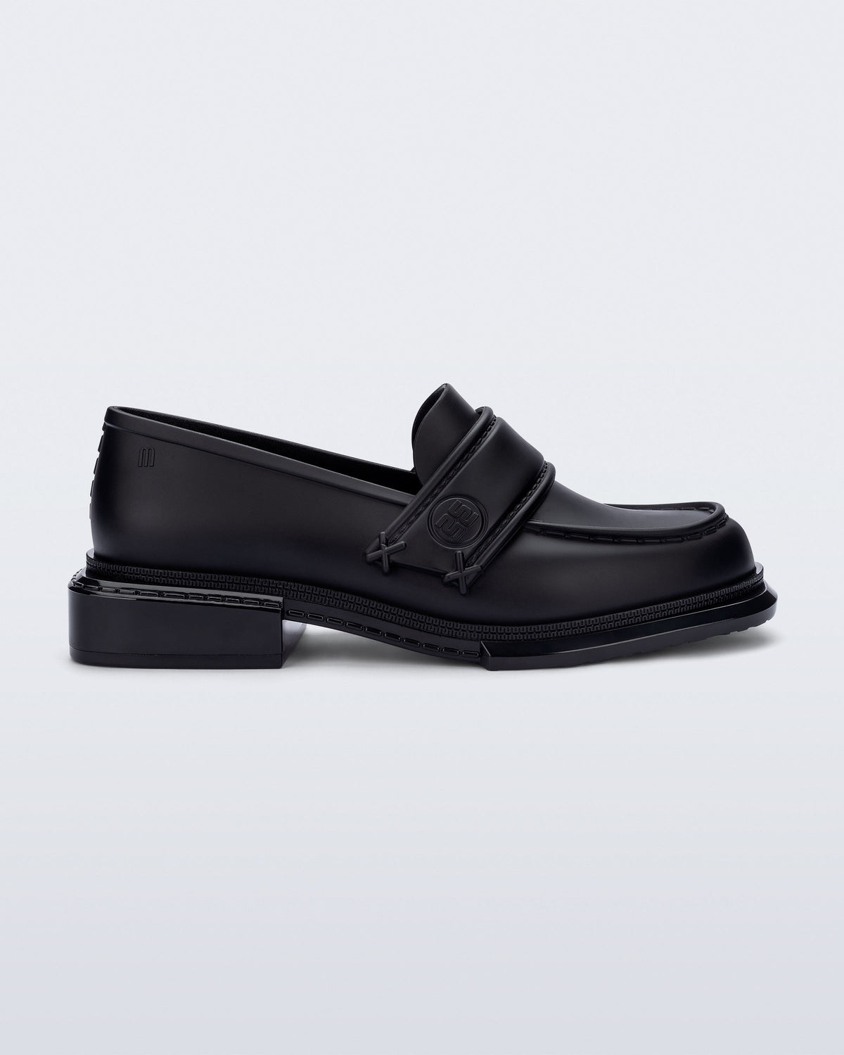 Side view of a black Spencer loafer