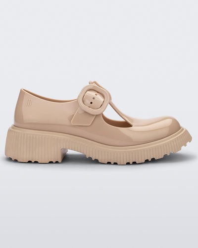 Side view of a beige Melissa Jackie loafer with two cut outs and a buckle detail strap.