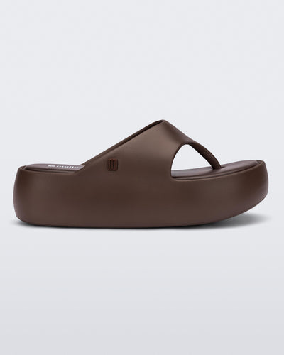 Side view of a bronze Free Platform Thong sandal