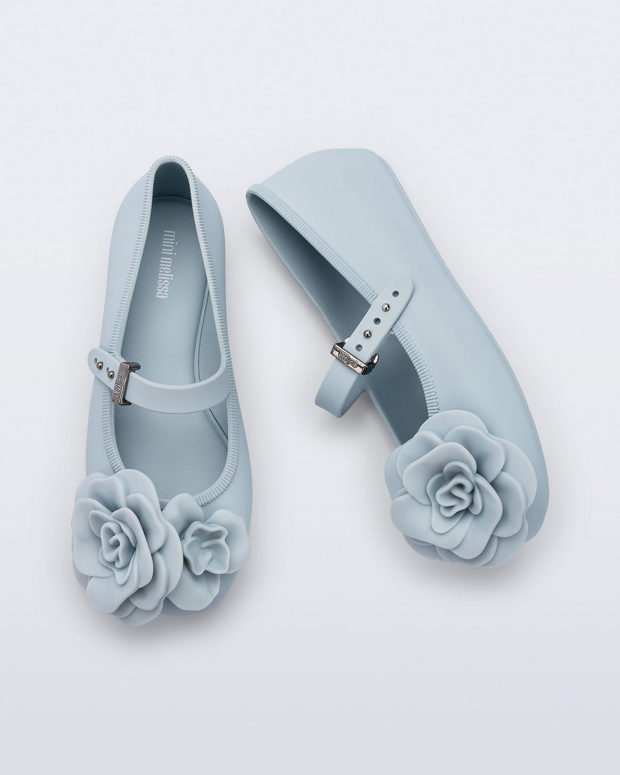 Side and top view of a pair of blue Soft Ballerina Petals kids flats