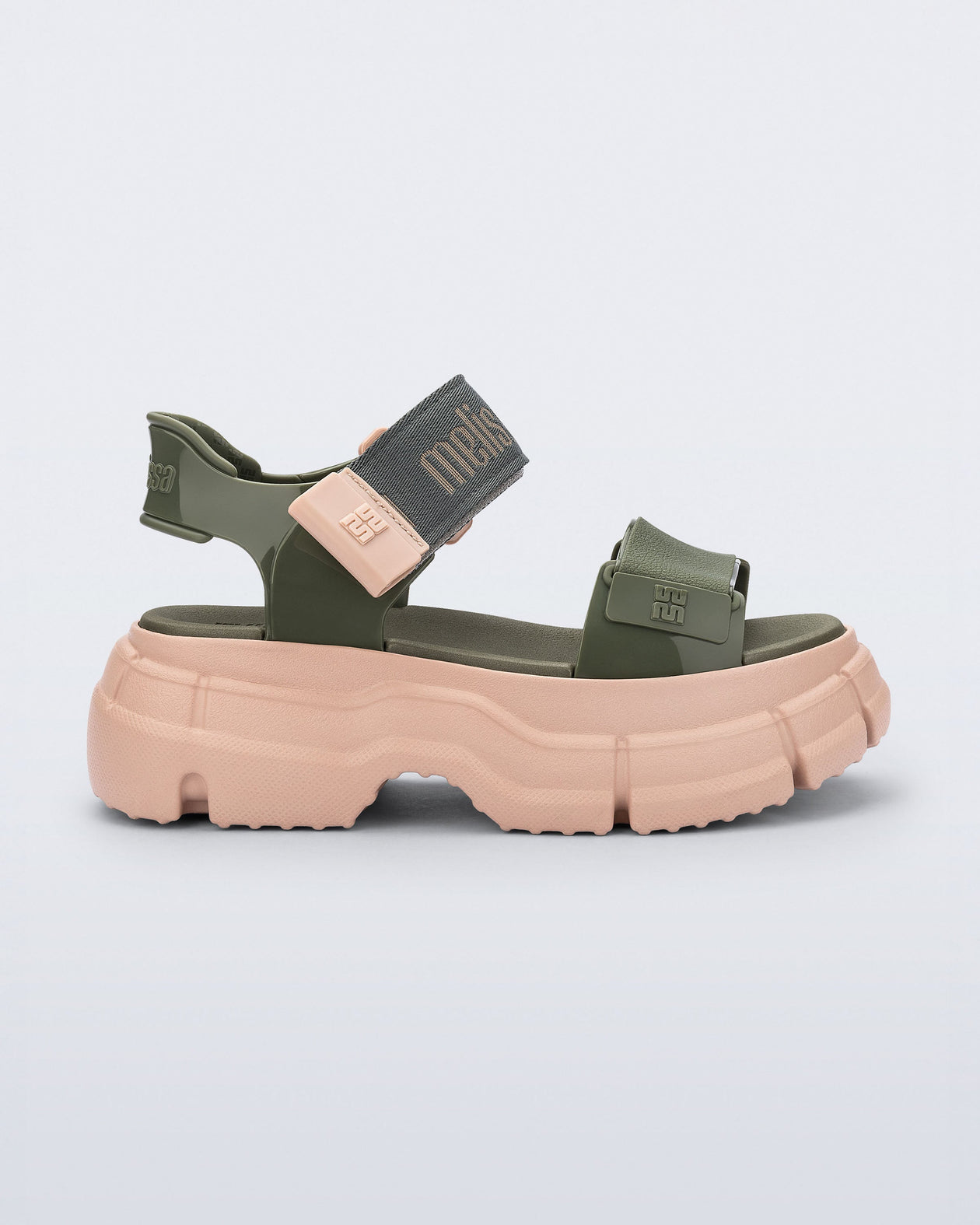 Side view of a green Pulse platform sandal with straps and pink sole