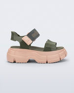 Side view of a green Pulse platform sandal with straps and pink sole