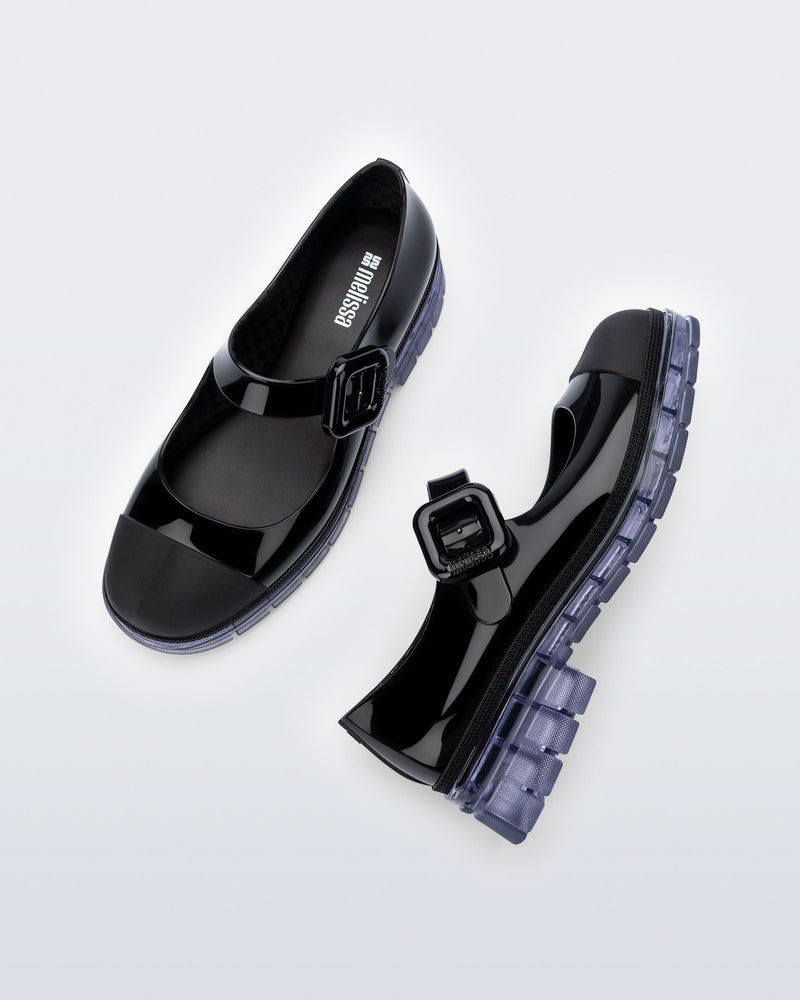 Top and side  view of a pair of black with clear sole June mary janes with matte toe cap