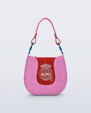 Back view of a pink Nina Bag + Alexandre Pavao shoulder bag with red accents