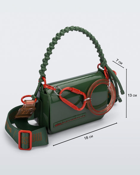 Angled view of an dark green Olga Bag + Alexandre Pavao with short strap fabric long  strap. With purse dimensions of 18cm x 7cm x 13cm
