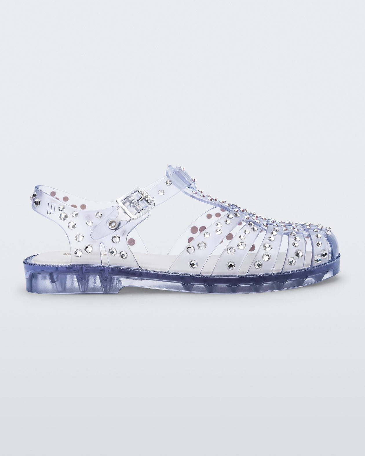 Side view of a clear Possession Crystals sandal