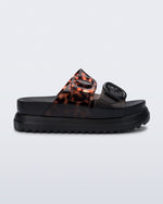 Side view of a black Cozy Platform with Tortoise straps