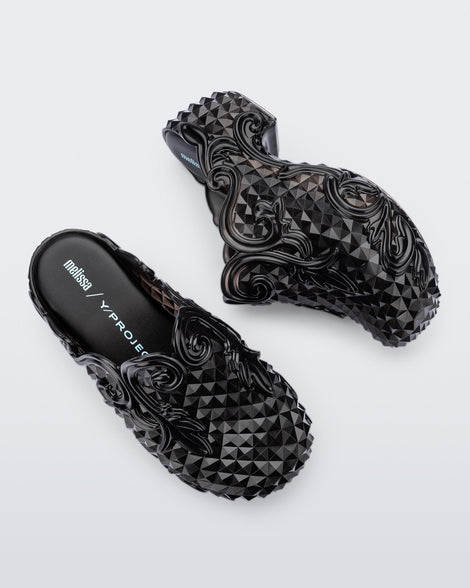 Top and side view of a pair of black Court Clog + Y/Project platform clogs