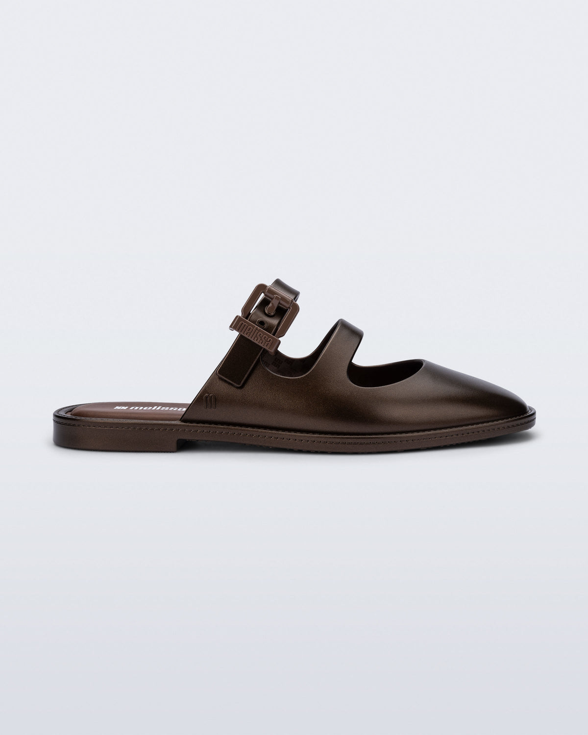 Side view of a bronze Anastasia mule slide with upper straps