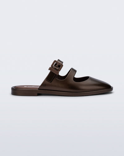 Side view of a bronze Anastasia mule slide with upper straps