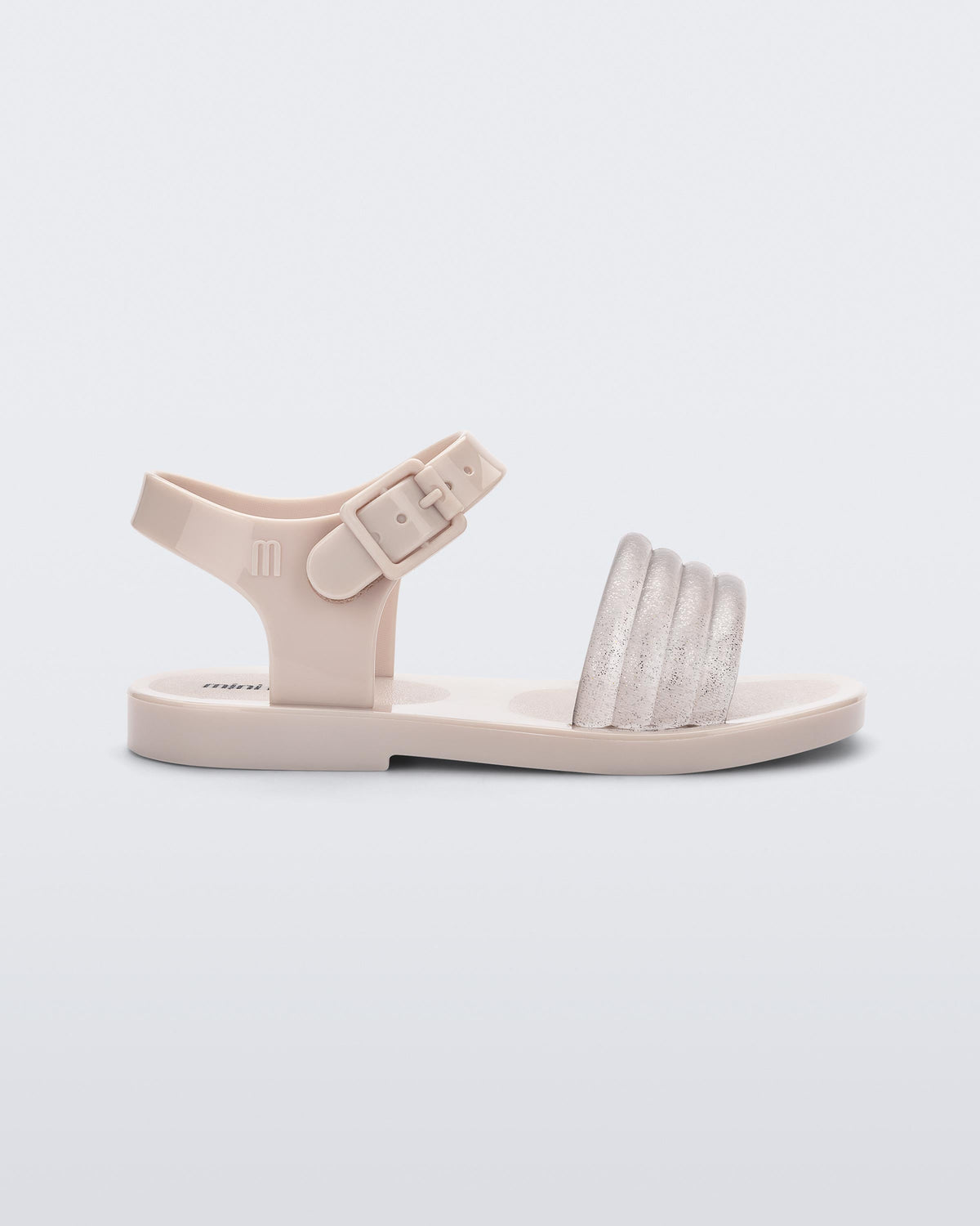 Side view of a beige Mar Wave baby sandal.