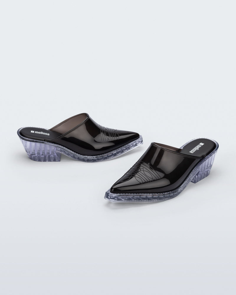 Side and angled view of a pair of black with clear heel Texas Mule heels
