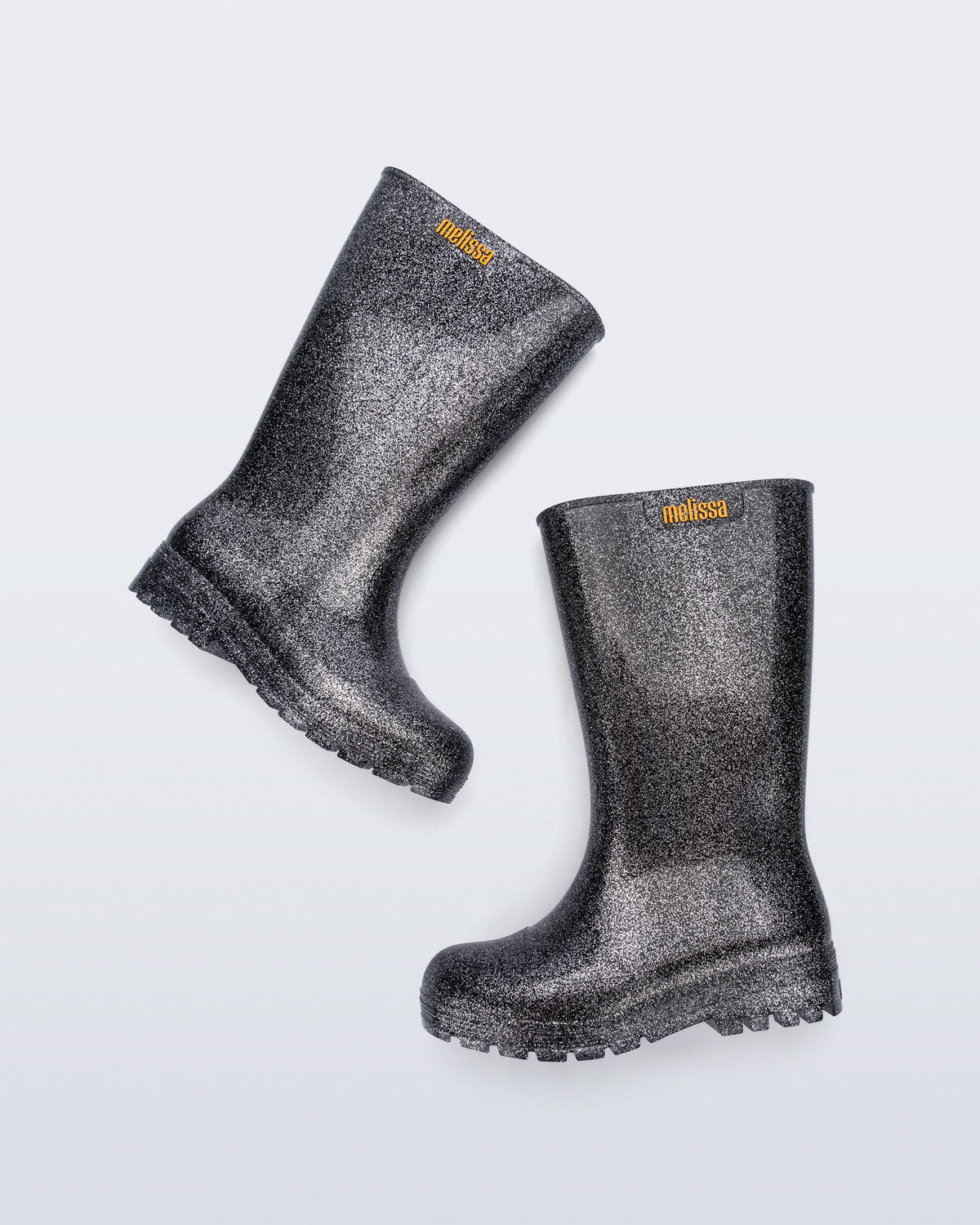 Side view of a black glitter Welly rainboot